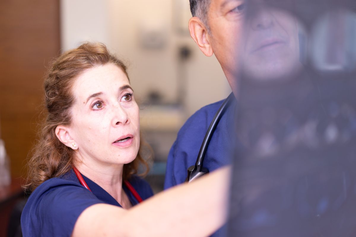 Doctors reviewing an X-ray in a clinical setting
